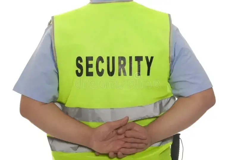 Security guard in high-visibility vest.