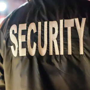 Security guard jacket with bold lettering.