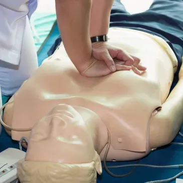 CPR training on a medical mannequin.
